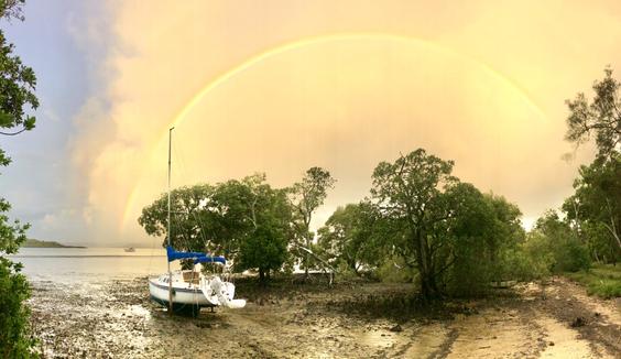 Shoreline rainbow at low tide